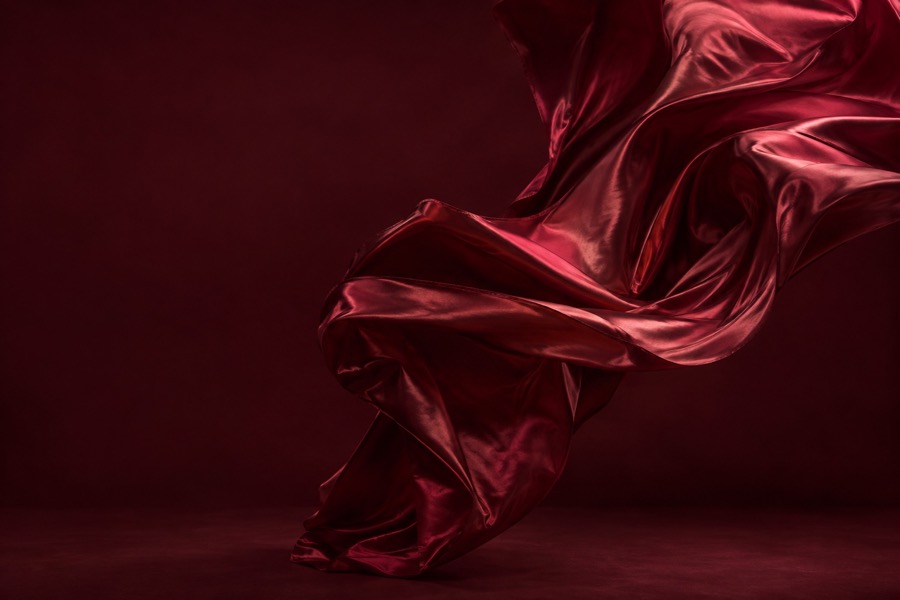 Detail of deep red silk in motion